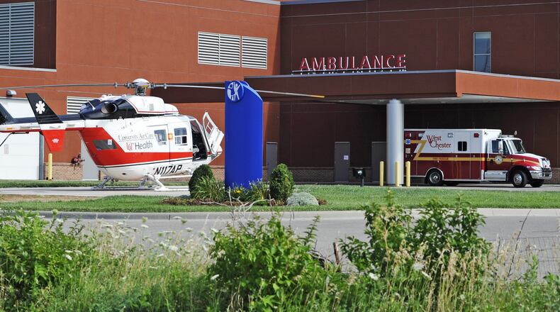 The University of Cincinnati Health Air Care helicopter is outside Cincinnati Children’s Liberty Campus waiting to transport a 2-year-old child who nearly drowned Wednesday, July 13, 2011. An ambulance was called to a home on Brighton Lane in West Chester Twp. around 4:30 p.m. to take the child to Cincinnati Children’s Liberty Campus on Yankee Road in Liberty Twp. The child was reportedly breathing upon arrival, and the medical helicopter was called to take the child to Cincinnati Children’s Hospital. Staff photo by Nick Graham