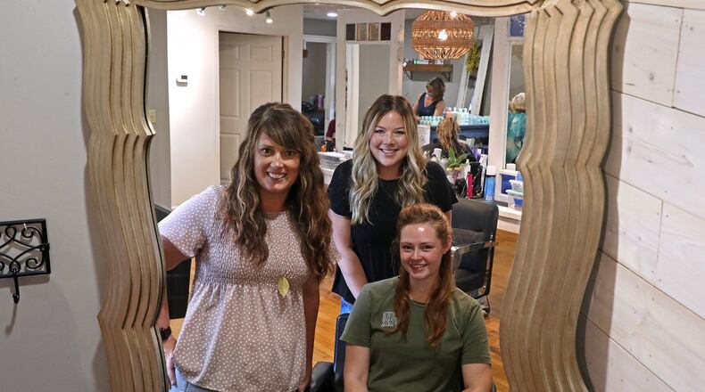 Heather Mercuri, left, owner of GLAM on the Go, will be featured in a Netflix series with fellow stylists, Emily Hanrahan, standing, and Heidi Goodbar. BILL LACKEY/STAFF