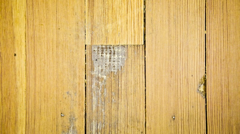The original hardwood floors from 1889 were recently discovered on the second floor of the historic Butler County Courthouse. Work is now underway to restore them. GREG LYNCH / STAFF