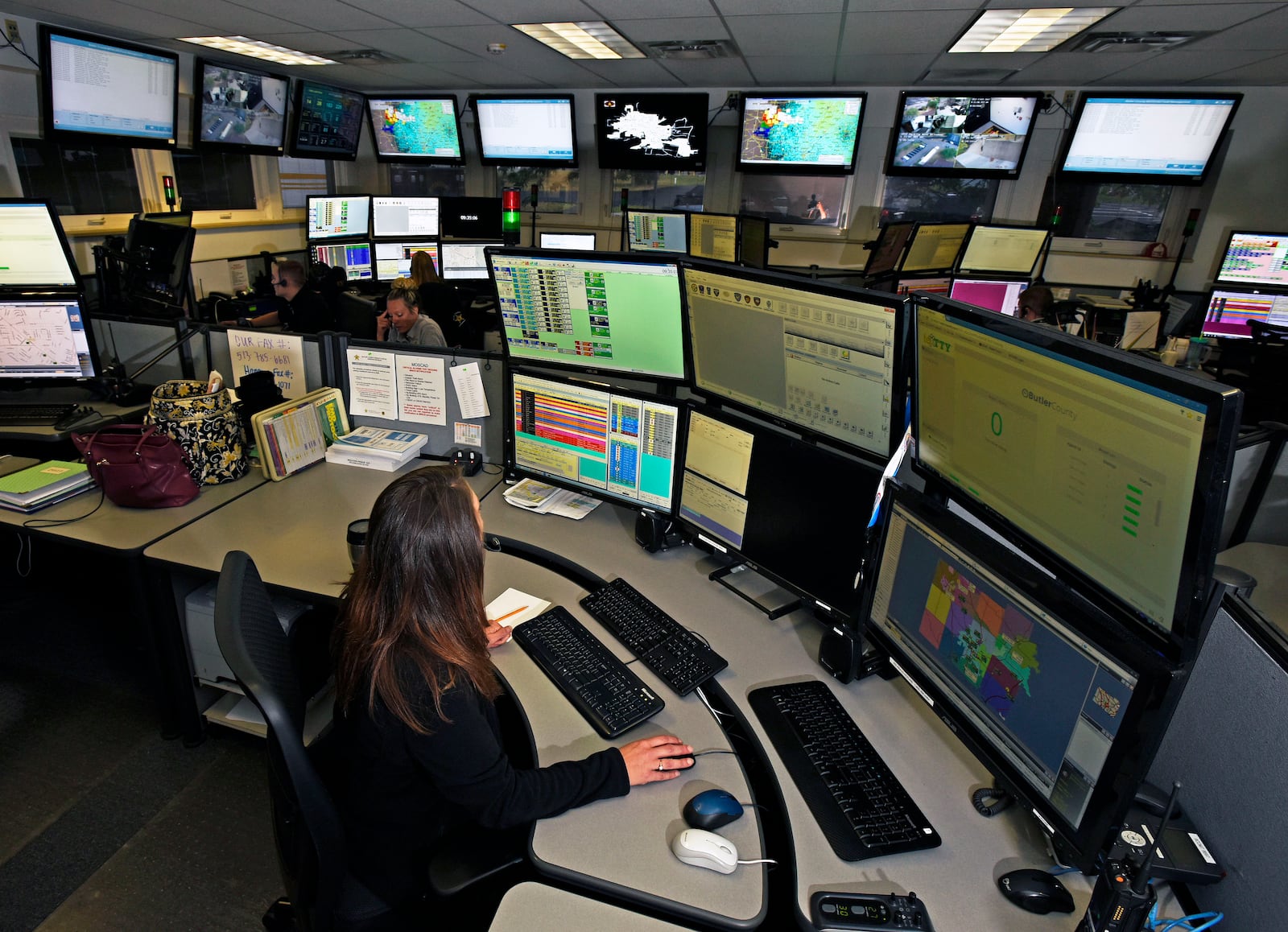 In this 2016 file photo, a Butler County dispatcher works in the Butler County Sheriff’s dispatch center. Some government officials in Butler County have said they were taken by surprise when learning it will cost $19.2 million to replace emergency communication equipment. NICK GRAHAM/STAFF