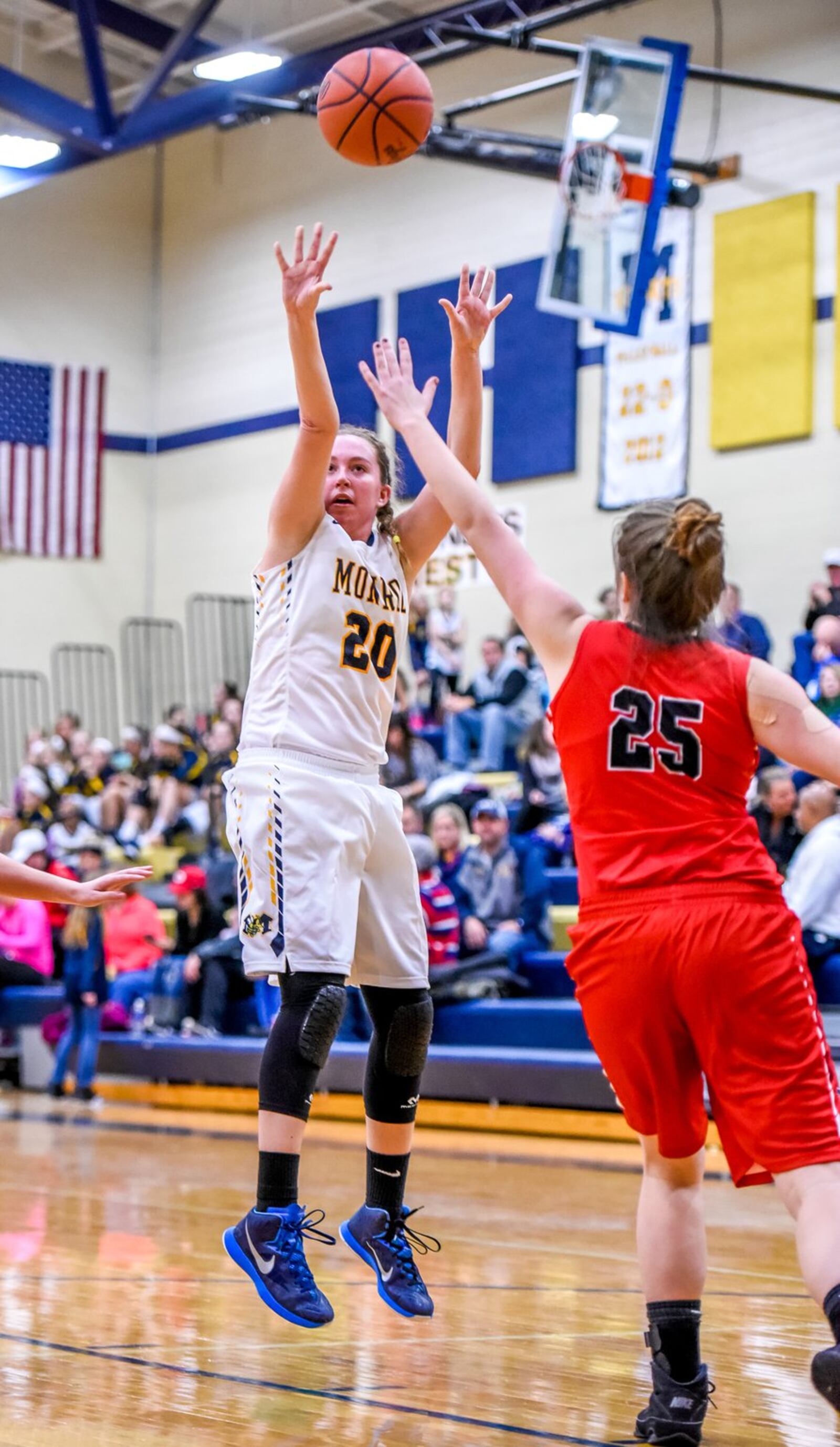Franklin’s Ashley Fisher (25) tries to defend a shot by Monroe’s Karley Gescuk during a game at Monroe on Dec. 15, 2016. NICK GRAHAM/STAFF