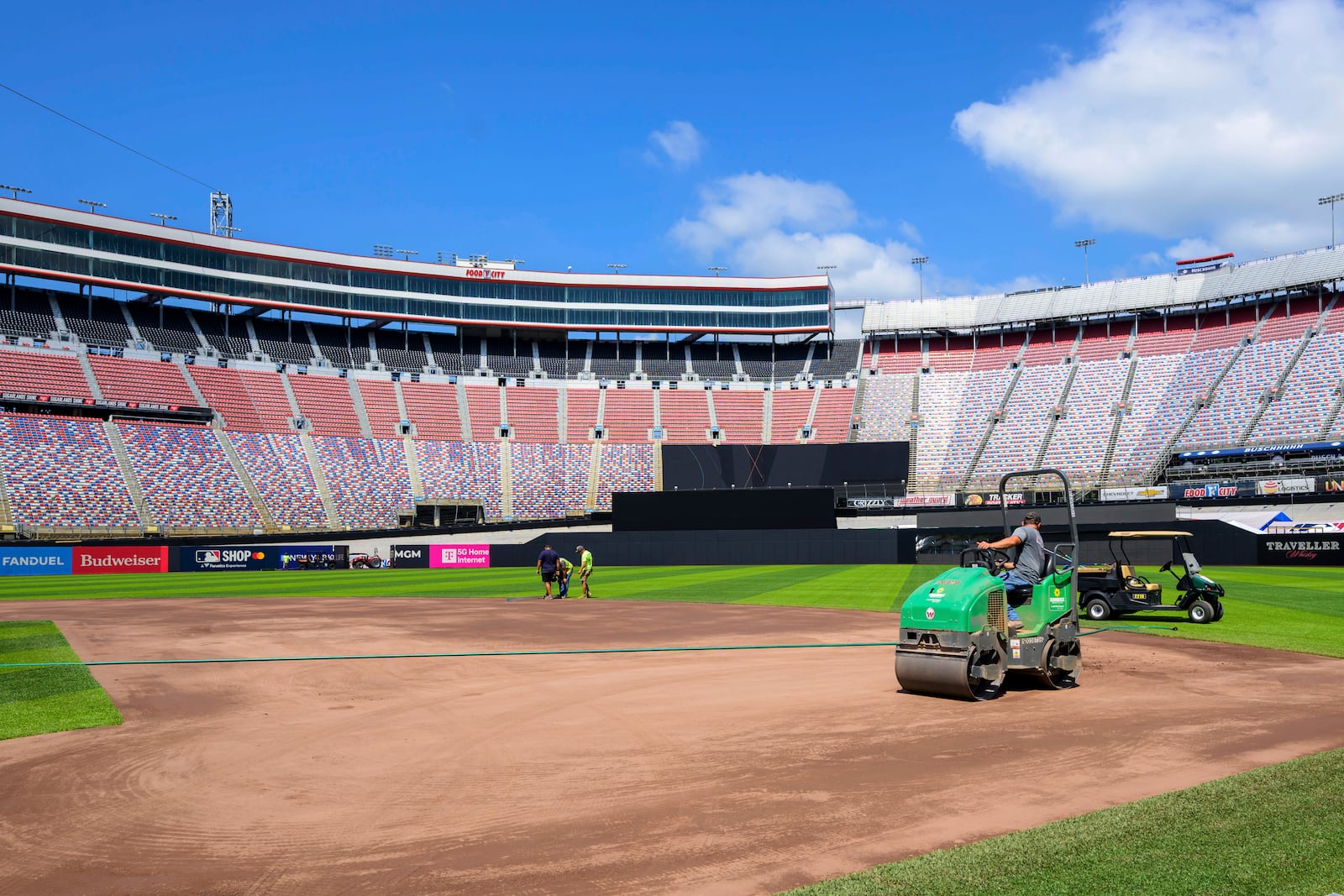 Work continues on the baseball field inside the racetrack at Bristol Motor Speedway, Friday, July 25, 2025, in Bristol, Tenn., for MLB Speedway Classic baseball game between the Cincinnati Reds and Atlanta Braves on Aug. 2. (Earl Neikirk/Bristol Motor Speedway via AP