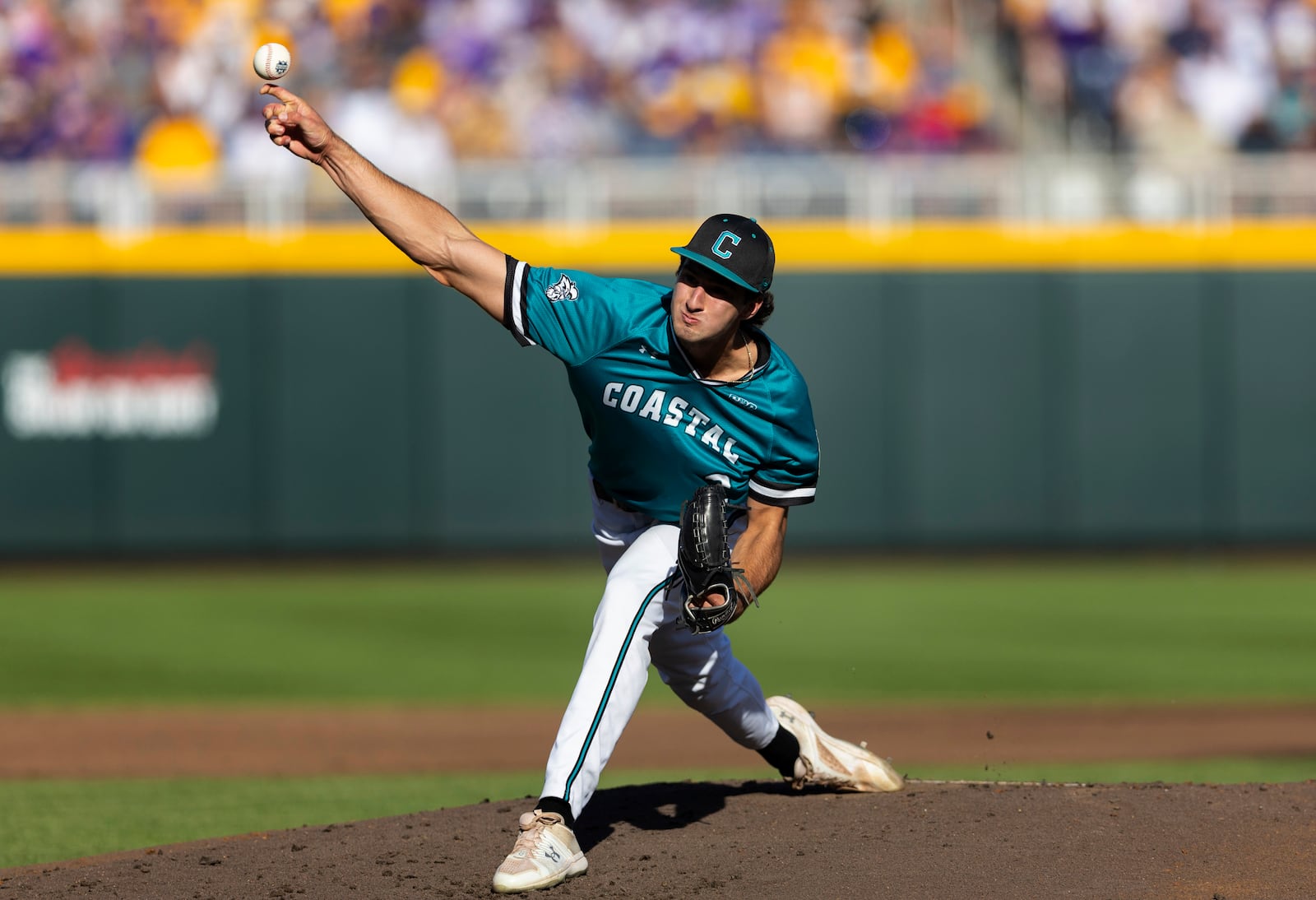 Coastal Carolina starting pitcher Cameron Flukey throws against LSU in the first inning of Game 1 of the NCAA College World Series baseball finals in Omaha, Neb., Saturday, June 21, 2025. (AP Photo/Rebecca S. Gratz)
