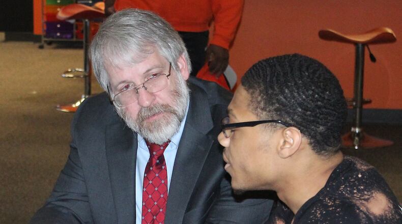 State Superintendent of Public Instruction Paolo DeMaria (left) listens to Darius Watkins discuss the impact of Career ConnectED on his education. Ohio has had only an interim state superintendent since DeMaria resigned in September 2021.  JEFF GUERINI/STAFF