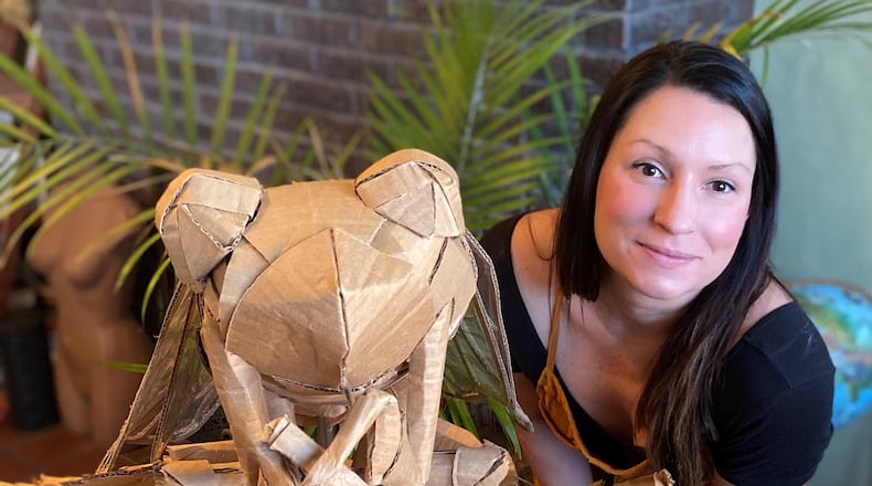 Leah Hughes is pictured with her award-winning “cicada” entry. Hughes was recently awarded a $500 cash prize for winning Saica Group’s “Sustainable Box Contest.” PROVIDED