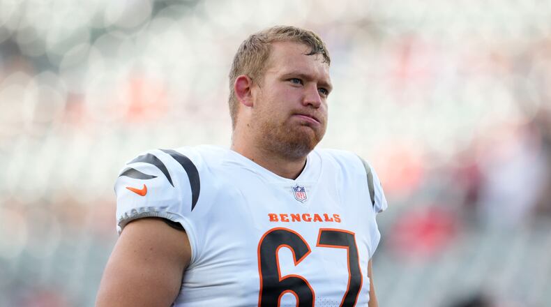 Cincinnati Bengals offensive tackle Cordell Volson exhales during warmups before an NFL football preseason game against the Arizona Cardinals in Cincinnati, Friday, Aug. 12, 2022. (AP Photo/Michael Conroy)