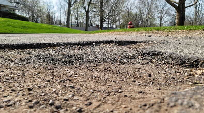 Rusmar Court in Middletown is one of the roads on the list to be repaved as part of a $31.3 million project. Scott Wright, a longtime resident on the street, complained about the conditions of the road during Tuesday's council meeting and he was delighted when told the street will be repaved. NICK GRAHAM/STAFF