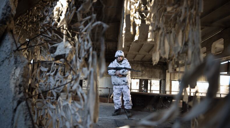 A Miami University professor, who travels frequently to the Ukraine, says he is in touch with Afghanistan refugees transported to the country from their homeland when American military forces withdrew from their country. Now housed in a Kiev hotel by the U.S., the Miami professor fears they will be abandoned should Russian forces invade Ukraine. Pictured is a Ukrainian soldier near the front lines in the border region next to Russia. (Tyler Hicks/The New York Times)