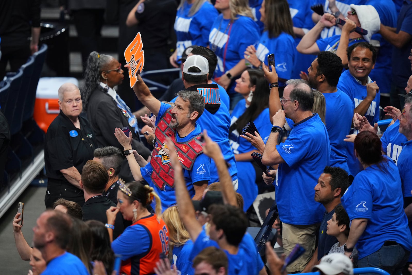 Oklahoma City Thunder fans cheer during the first half of Game 2 of the NBA Finals basketball series against the Indiana Pacers Sunday, June 8, 2025, in Oklahoma City. (AP Photo/Kyle Phillips)