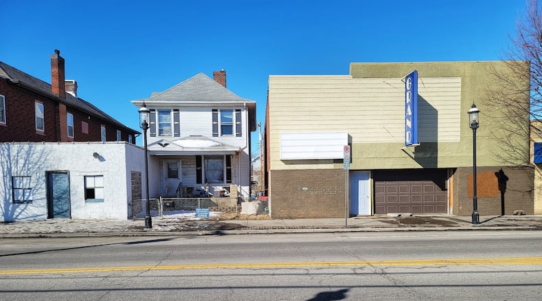 Hamilton City Council on Wednesday will consider buying the property containing the former Grand theater, at 2233 Pleasant Ave., and the house next door at 2241 Pleasant, along with three other properties. NICK GRAHAM/STAFF