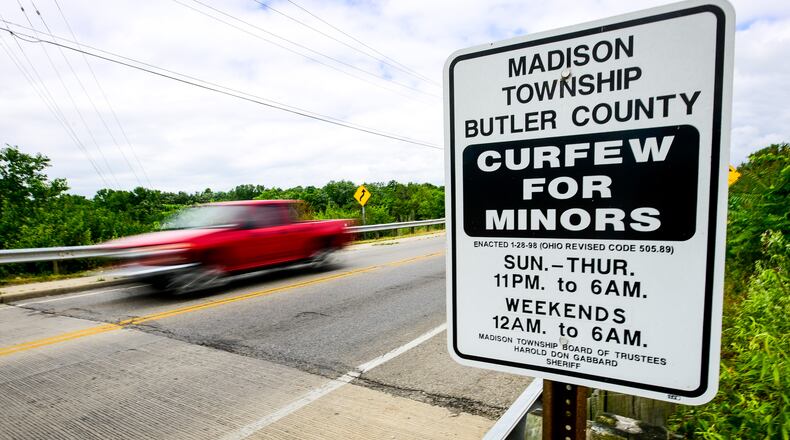 A sign displaying curfew times for minors is on display along OH-122 entering Madison Township. Middletown police recently reminded people via Facebook about the city’s curfew for juveniles, which has been on the books for years. Middletown Police Chief Rodney Muterspaw said in recent years it has been enforced and admitted it is a rather old-fashion law, but a jump in juvenile arrests going into the summer and what officers are seeing on the street means the curfew laws will have more teeth this year. NICK GRAHAM/STAFF