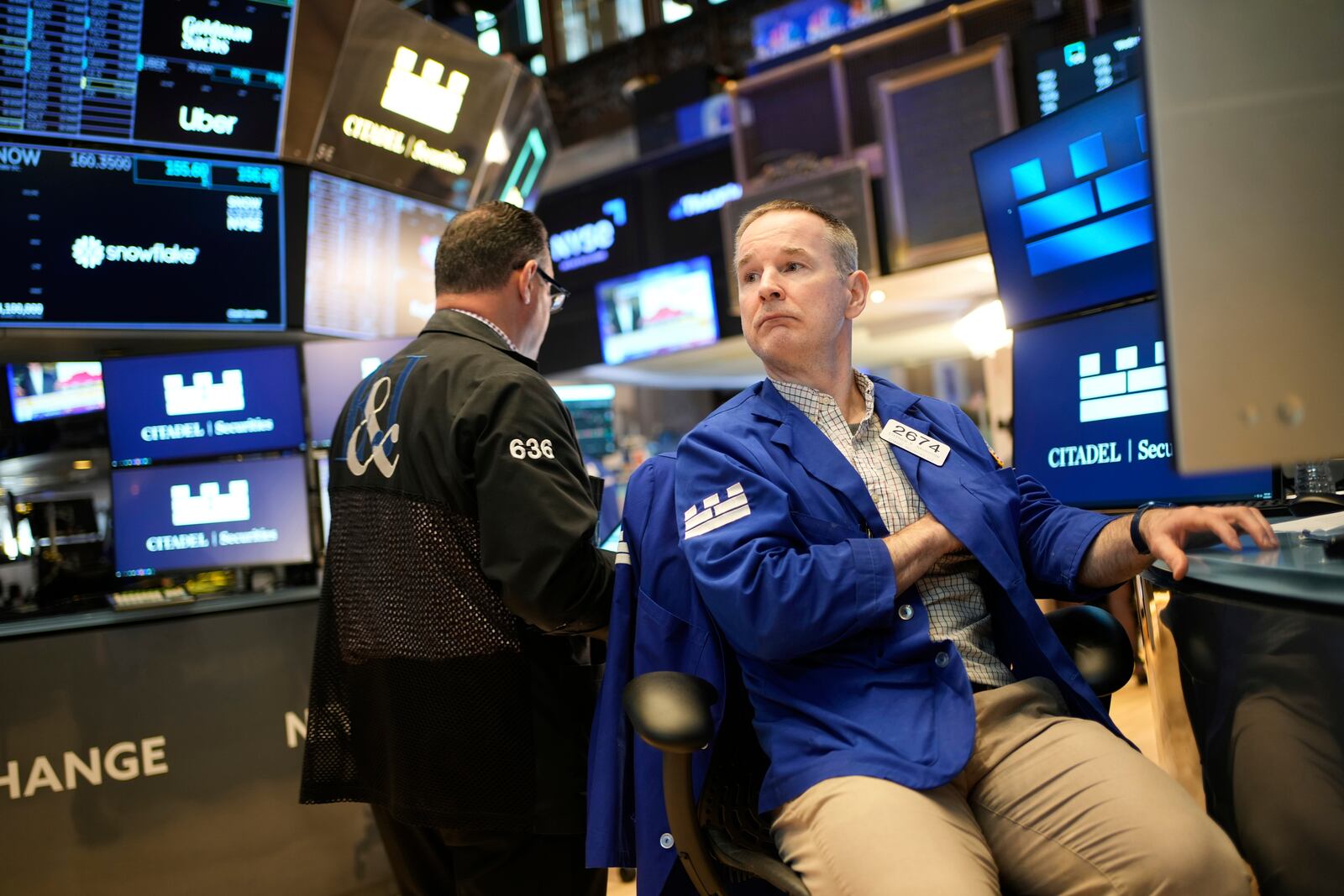 Stephen Naughton works on the floor at the New York Stock Exchange in New York, Wednesday, April 30, 2025. (AP Photo/Seth Wenig)
