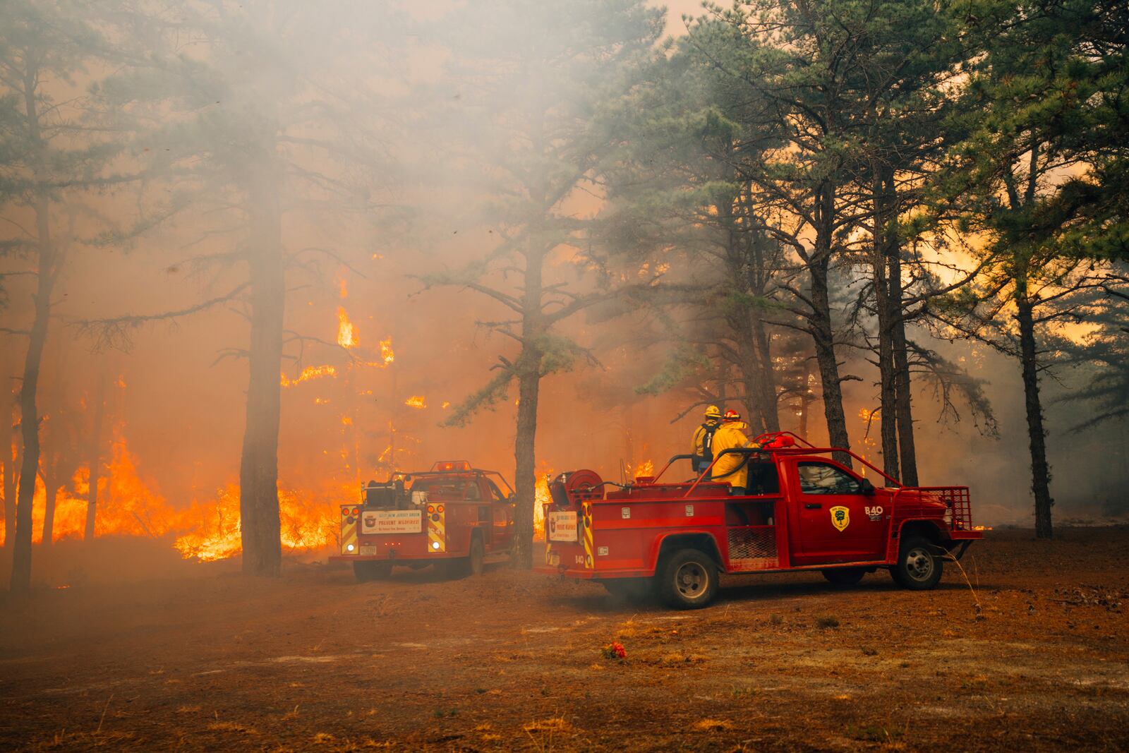 Firefighters battle a wildfire in Ocean County, N.J. on Thursday, April 24, 2025. (New Jersey Department of Environmental Protection via AP)