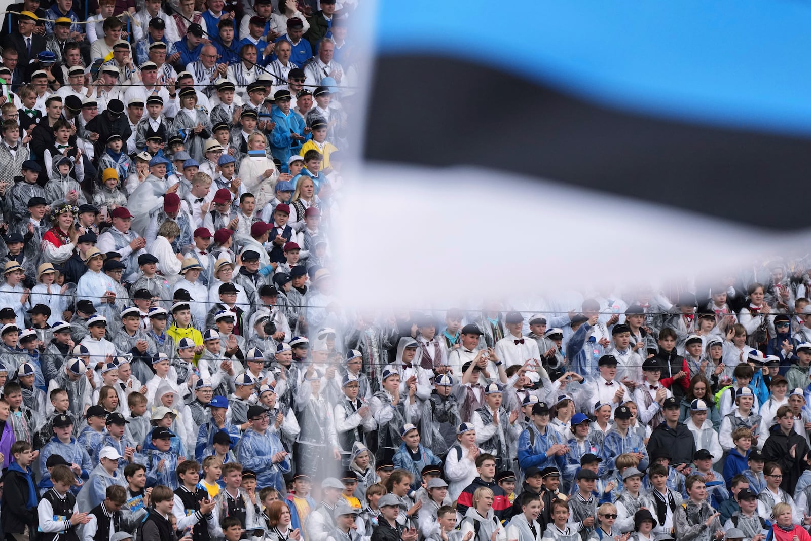 Choir singers attend the "Iseoma" Song and Dance Celebration at the Song Festival Grounds in Tallinn, Estonia, on Sunday, July 6, 2025. (AP Photo/Sergei Grits)