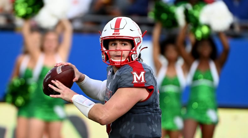 FILE -Miami quarterback Brett Gabbert looks for a receiver during the second half of the team's Frisco Football Classic NCAA college football game against North Texas in Frisco, Texas, Thursday, Dec. 23, 2021.  Gabbert tossed three touchdown pass to Mac Hippenhammer in Tuesday's loss to Ohio. (AP Photo/Matt Strasen, File)