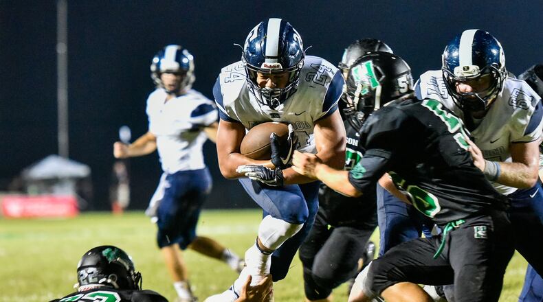 Edgewood’s Elijah Williams breaks through the line for a touchdown during Friday night’s game against host Harrison at Bill Kuntz Field. NICK GRAHAM/STAFF