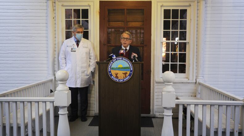 Ohio Governor Mike DeWine along with Kevin Sharrett, MD, held a press conference at the governor's home early Wednesday morning. MARSHALL GORBY\STAFF