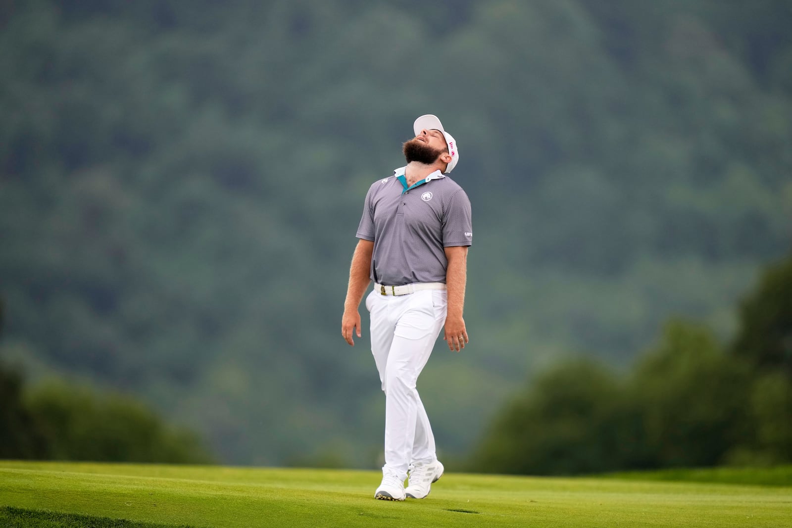 Tyrrell Hatton, of England, reacts after hitting his ball into the rough on the 17th hole during the final round of the U.S. Open golf tournament at Oakmont Country Club Sunday, June 15, 2025, in Oakmont, Pa. (AP Photo/Seth Wenig)