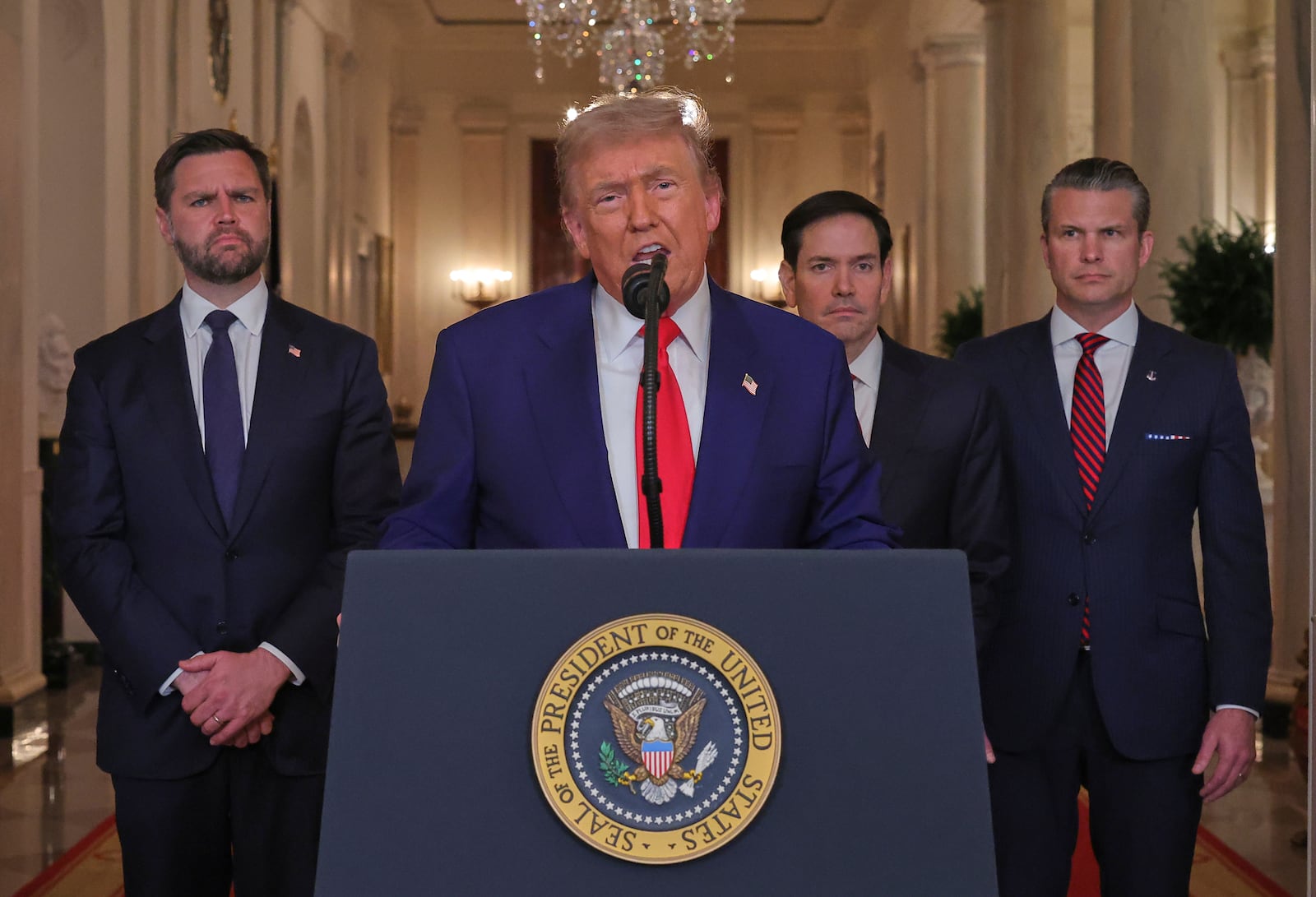 President Donald Trump speaks from the East Room of the White House in Washington, Saturday, June 21, 2025, after the U.S. military struck three Iranian nuclear and military sites, directly joining Israel's effort to decapitate the country's nuclear program, as Vice President JD Vance, Secretary of State Marco Rubio and Defense Secretary Pete Hegseth listen. (Carlos Barria/Pool via AP)