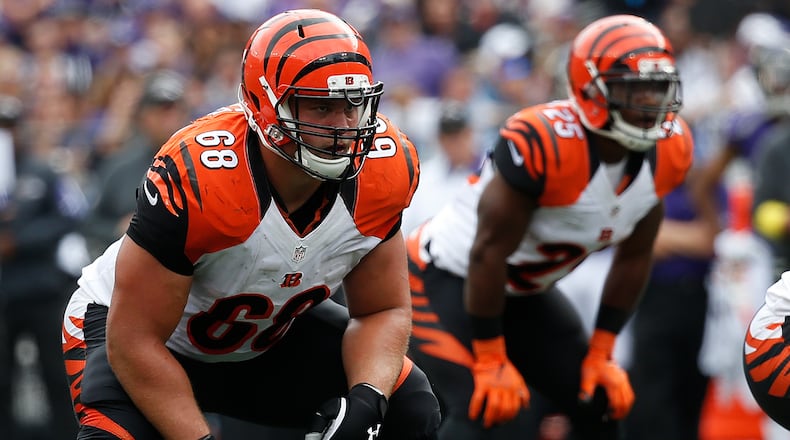 BALTIMORE, MD - SEPTEMBER 27: Guard Kevin Zeitler #68 of the Cincinnati Bengals and running back Giovani Bernard #25 of the Cincinnati Bengals stand at the line of scrimmage in the second quarter of a game against the Baltimore Ravens at M&T Bank Stadium on September 27, 2015 in Baltimore, Maryland. (Photo by Rob Carr/Getty Images)