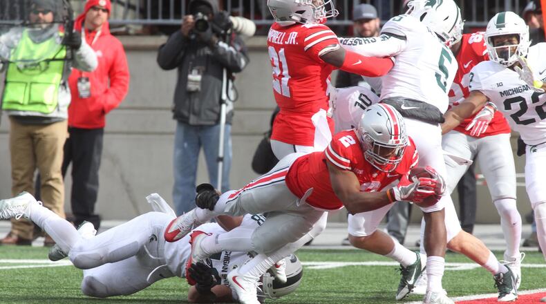 Ohio State’s J.K. Dobbins scores against Michigan State on Saturday, Nov. 11, 2017, at Ohio Stadium in Columbus. David Jablonski/Staff