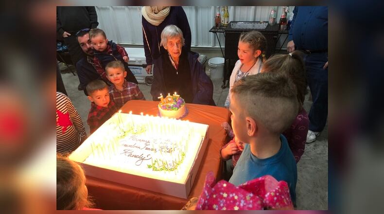 Fearn Gerber’s family lit 107 candles for her 107th birthday celebration Saturday in her home. Five-inch candles were lit with a lighter and they were blown out by Gerber and 16 of her great-great-grandchildren. SUBMITTED PHOTO