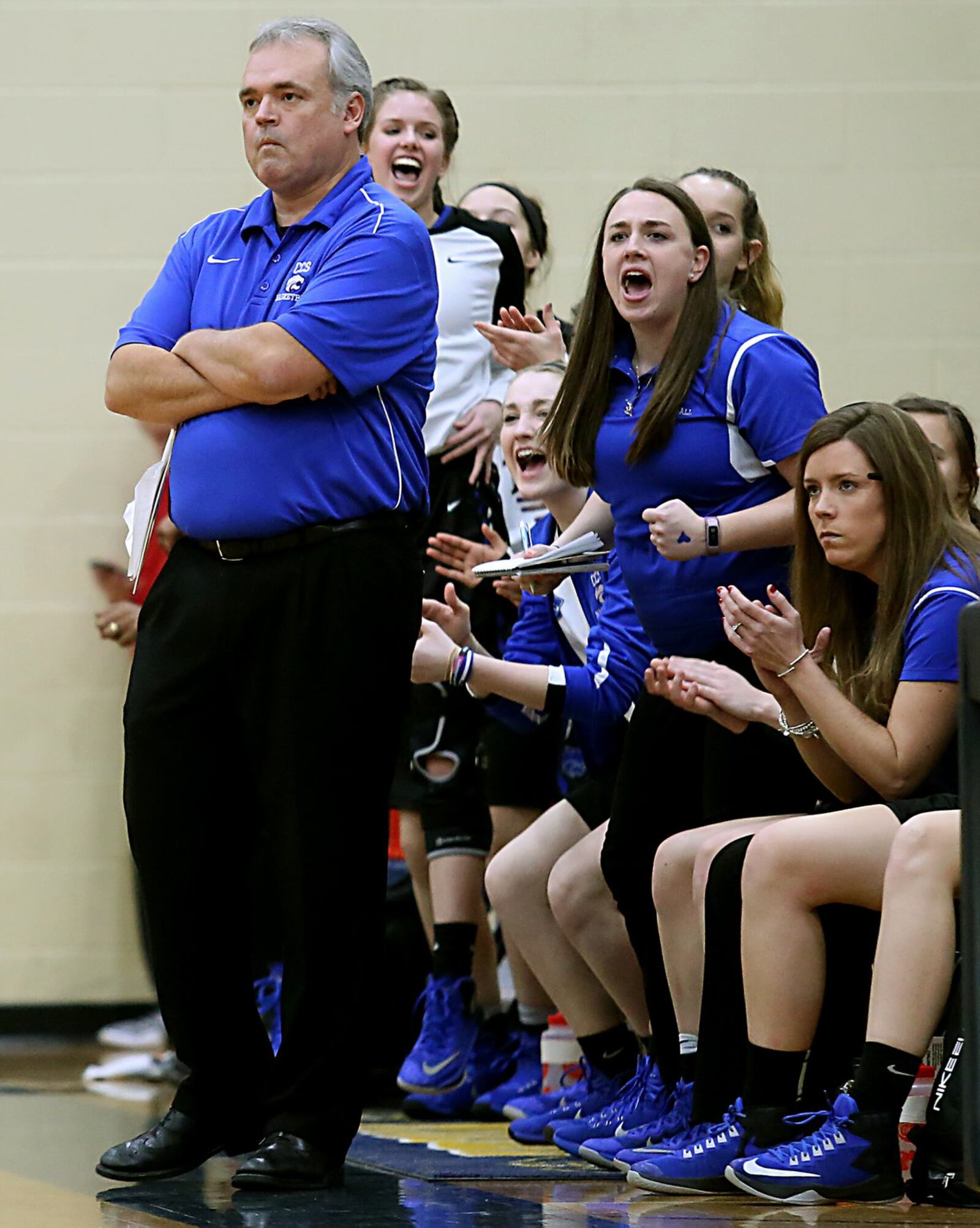 Cincinnati Christian coach Paul Owens remains nonplussed as his bench reacts with cheers during Tuesday night’s Division IV sectional game against Miami Valley Christian Academy at Monroe. CONTRIBUTED PHOTO BY E.L. HUBBARD