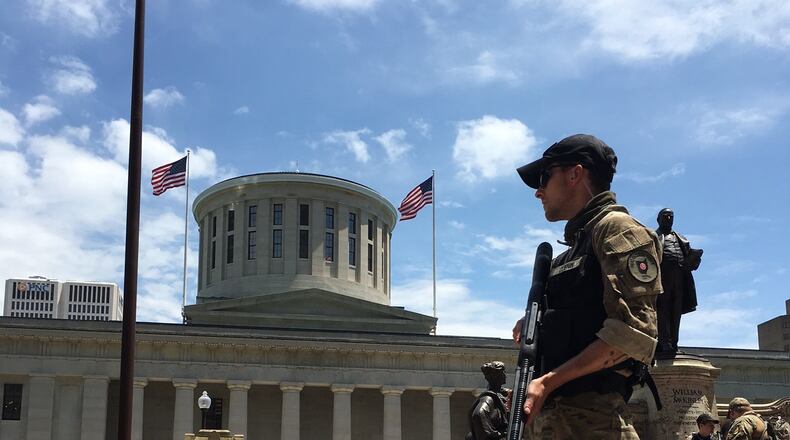 The battle over gun laws is fought at the Ohio Statehouse every year. Those for and against legislation routinely lobby lawmakers, pack hearing rooms and hold rallies, such as this demonstration in favor of the right to openly carry firearms in Ohio. LAURA BISCHOFF/STAFF