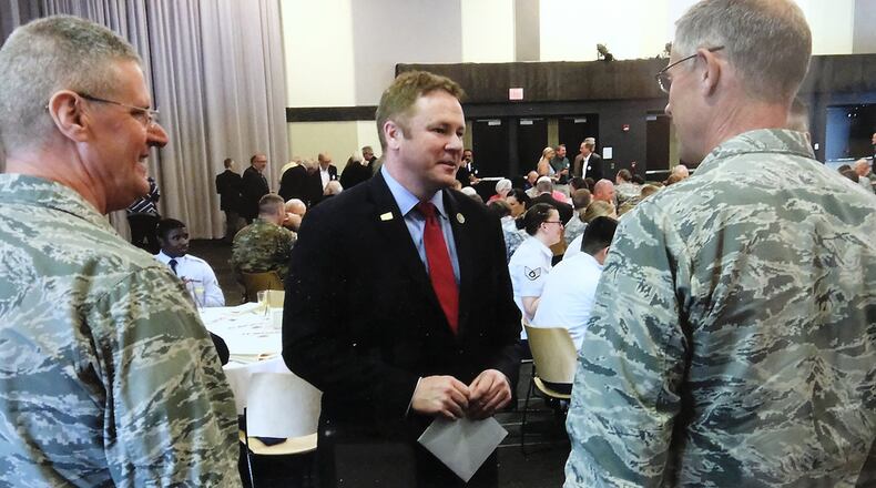 FILE: U.S. Rep. Warren Davidson’s talks to National Guard officials before the annual Military Appreciation Luncheon on Monday. Bill Lackey/Staff