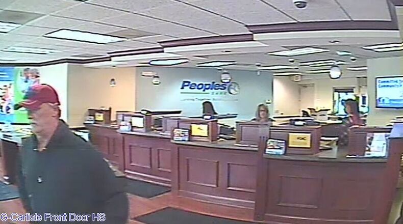 A surveillance camera took a photo of the man believed to have robbed the Peoples Bank branch in Carlisle on March 14, 2019. Carlisle police have identified him as Mark Lunsford, 58, of Fairfield Twp. CONTRIBUTED