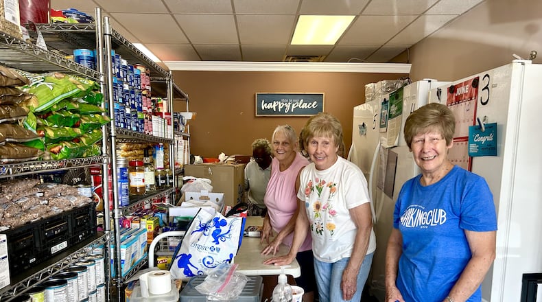 Village Food Pantry workers pick the days they want to volunteer. Some show up every day. TAYLOR STUMBAUGH/STAFF