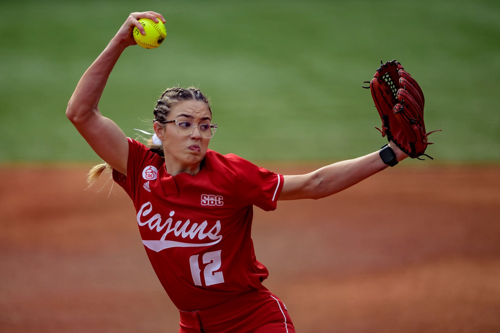 FILE - Louisiana starting pitcher Sam Landry (12) throws against California during an NCAA softball game on Friday, Feb 9, 2024, in Lafayette, La. (AP Photo/Matthew Hinton, File)