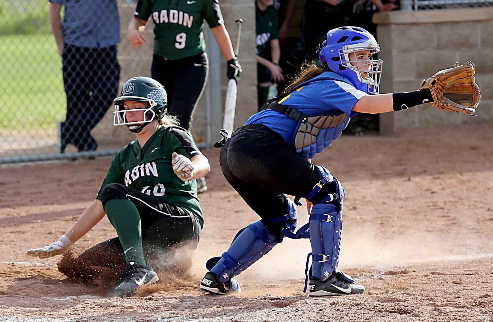 Badin’s Sam Sander crosses the plate ahead of the throw to Clermont Northeastern catcher Kayla Nichols during Monday’s Division III district final at Kings. CONTRIBUTED PHOTO BY E.L. HUBBARD