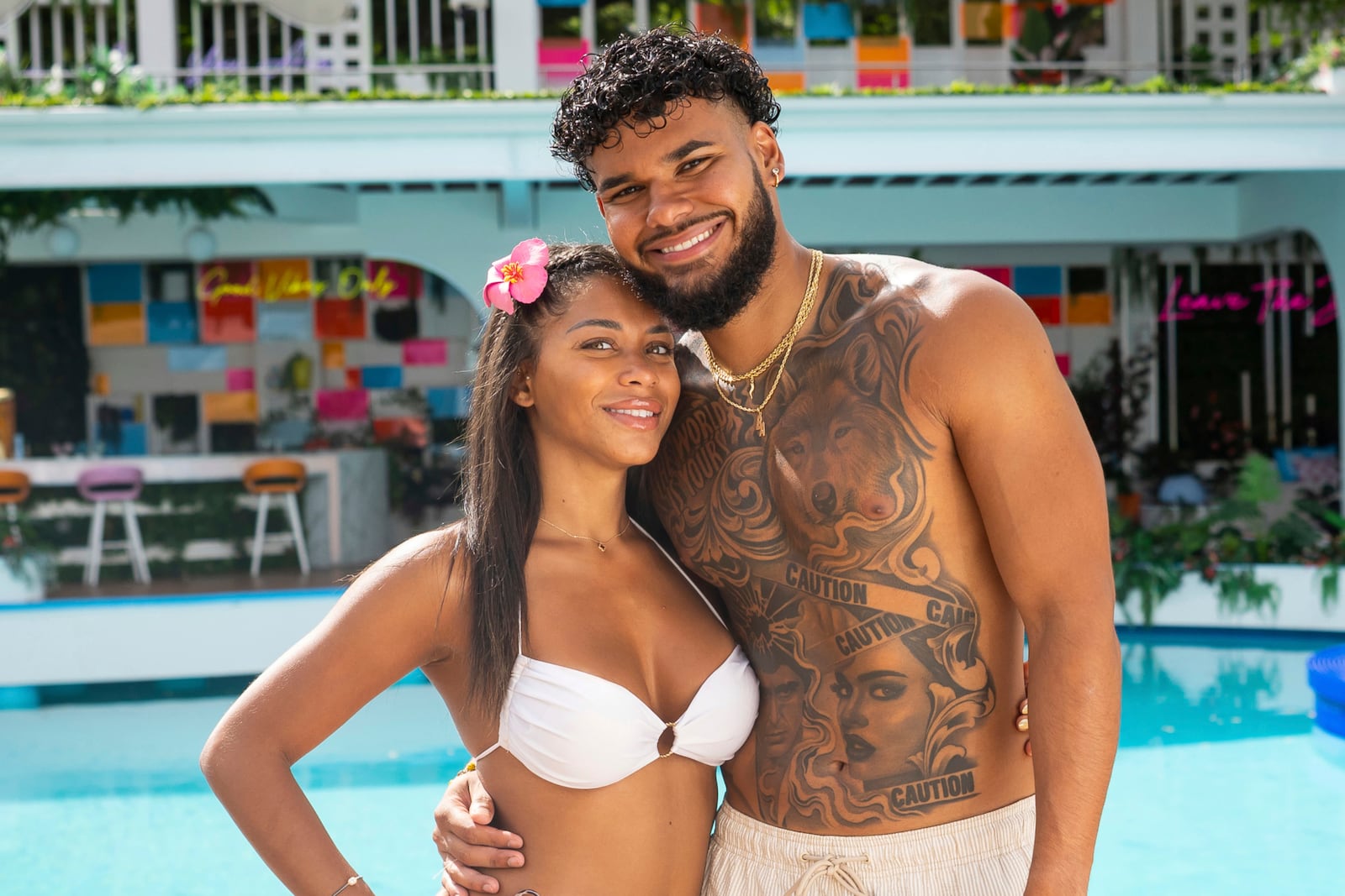 This image released by Peacock shows Amaya Espinal, left, and Bryan Arenales from the reality series "Love Island USA." (Photo by: Ben Symons/Peacock)