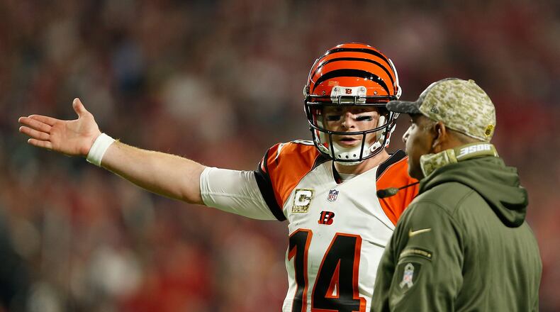 GLENDALE, AZ - NOVEMBER 22: Quarterback Andy Dalton #14 of the Cincinnati Bengals (left) talks with head coach Marvin Lewis (right) during the first half of the NFL game against the Arizona Cardinals at the University of Phoenix Stadium on November 22, 2015 in Glendale, Arizona.  (Photo by Christian Petersen/Getty Images)