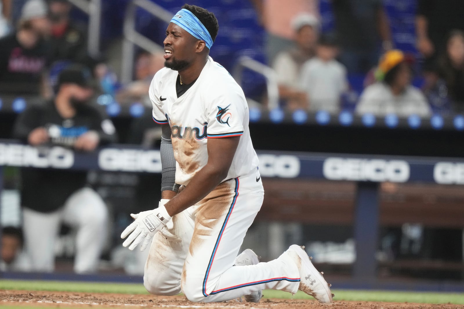 Miami Marlins' Jesus Sanchez reacts after being called out at the plate during the seventh inning of a baseball game against the Colorado Rockies, Wednesday, June 4, 2025, in Miami. (AP Photo/Lynne Sladky)