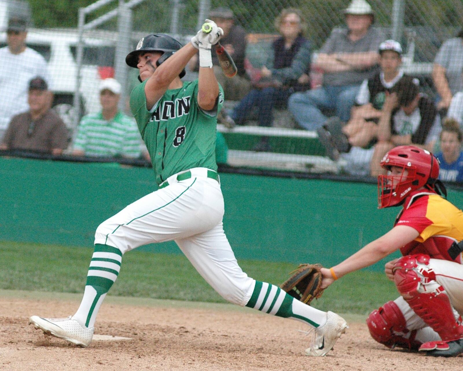 Badin’s Kaden Kimbrell takes a big swing Wednesday during a 12-2, five-inning victory over visiting Fenwick in Greater Catholic League Coed Division baseball play at Alumni Field in Joyce Park. RICK CASSANO/STAFF