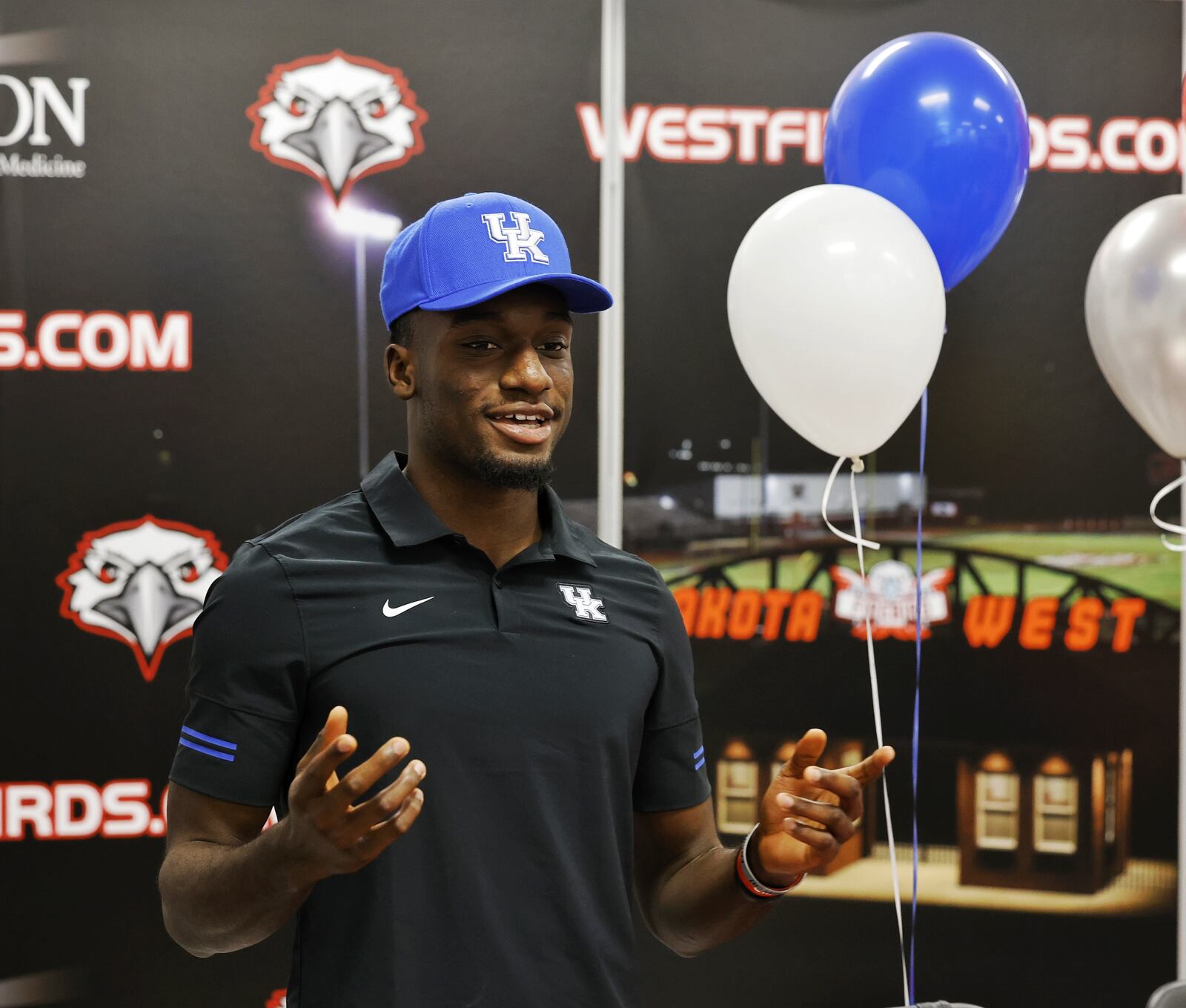 Lakota West's Alex Afari speaks to the crowd during a national letter of intent college football signing ceremony Wednesday, Dec. 15, 2021 at Lakota West High School. Afari is signing with University of Kentucky. NICK GRAHAM / STAFF