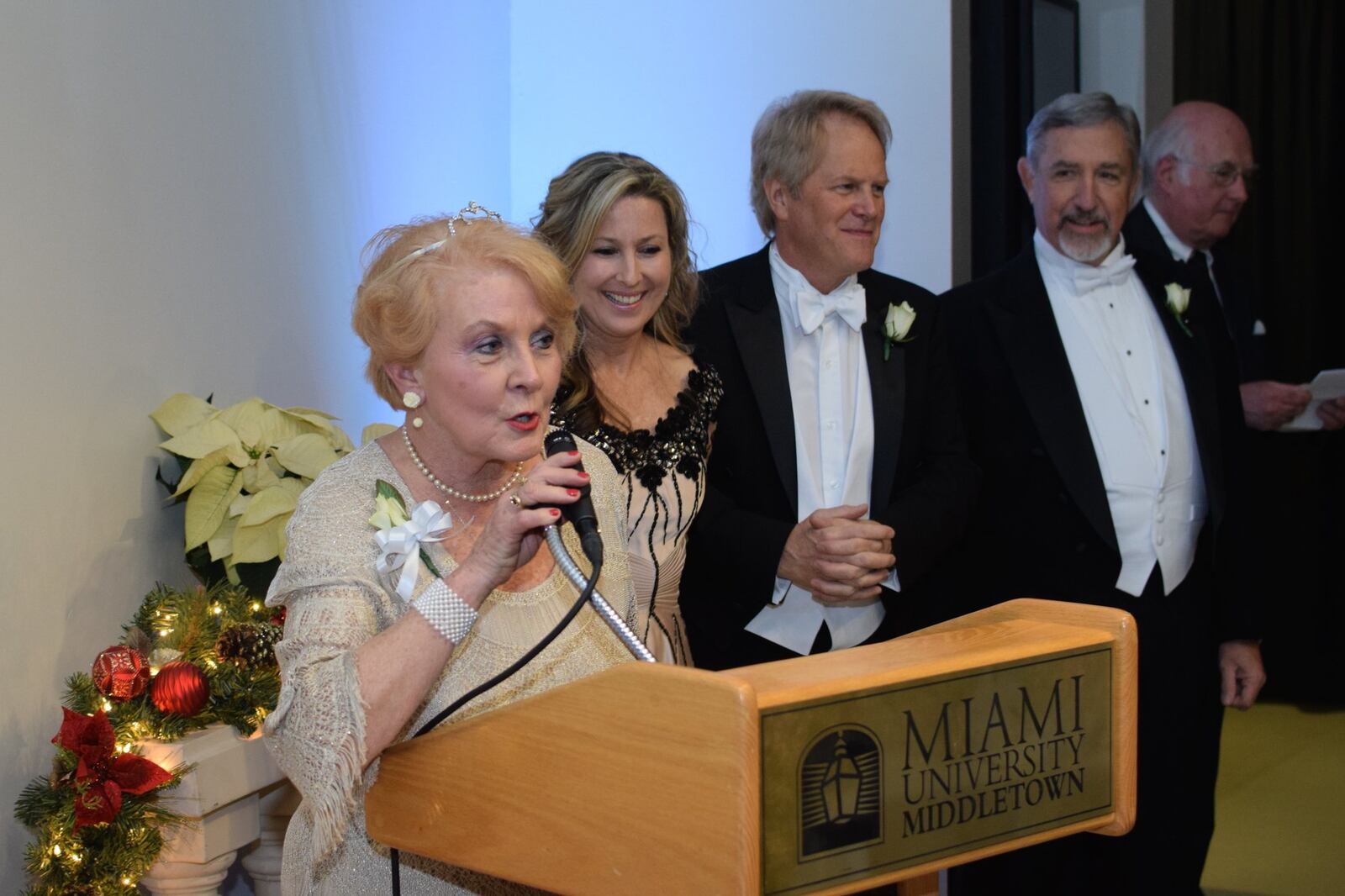Frances Sack, one of the co-chairs, addresses the crowd at the 95th annual Charity Ball last weekend at Miami University Middletown. She is joined at the podium by (from left) chairs Jamie Murphy and Phillip Harrison and Dan Sack, and master of ceremonies John Renick. CONTRIBUTED PHOTO