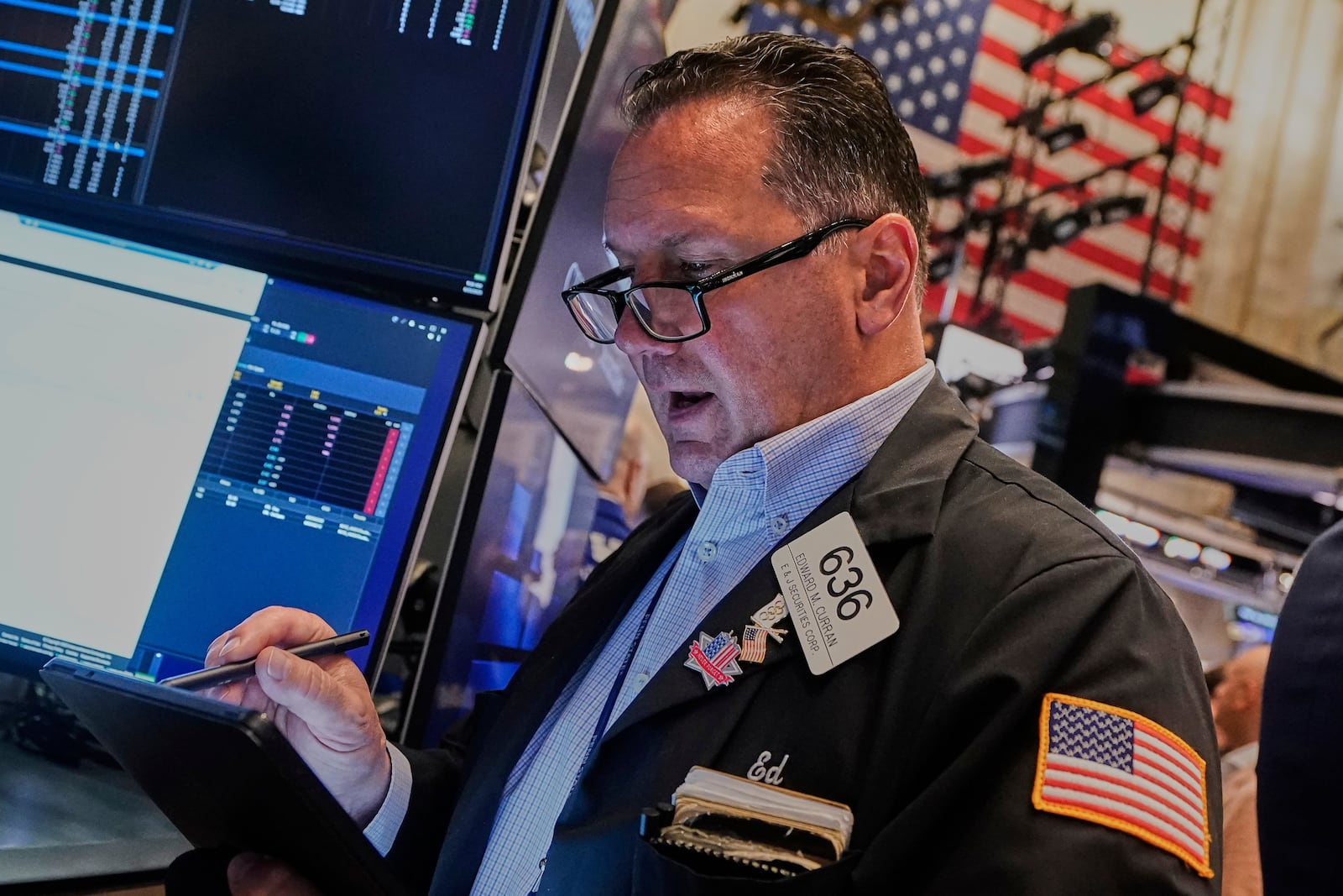 Trader Edward Curran works on the floor of the New York Stock Exchange, Monday, June 23, 2025. (AP Photo/Richard Drew)