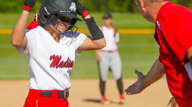 Madison’s Kenzi Saunders (19) is congratulated by coach Doug Pemberton after hitting a triple during a Division III sectional final against Carlisle at Fenwick on May 15, 2017. The Mohawks won 3-1, giving Pemberton what turned out to be the final victory of his prep coaching career. He died of a heart attack just over a month later. GREG LYNCH/STAFF
