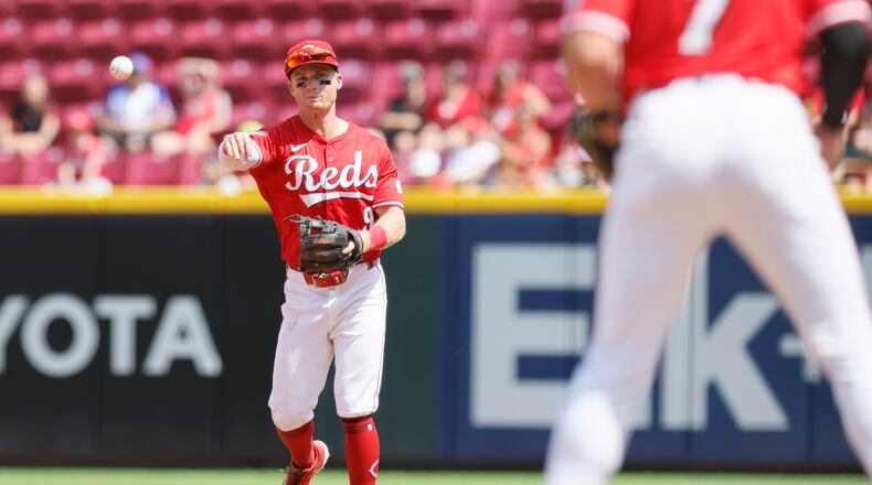 Cincinnati Reds second baseman Matt McLain throw out Colorado Rockies' Mickey Moniak at first base during the seventh inning of a baseball game Sunday, July 13, 2025, in Cincinnati. (AP Photo/Jay LaPrete)