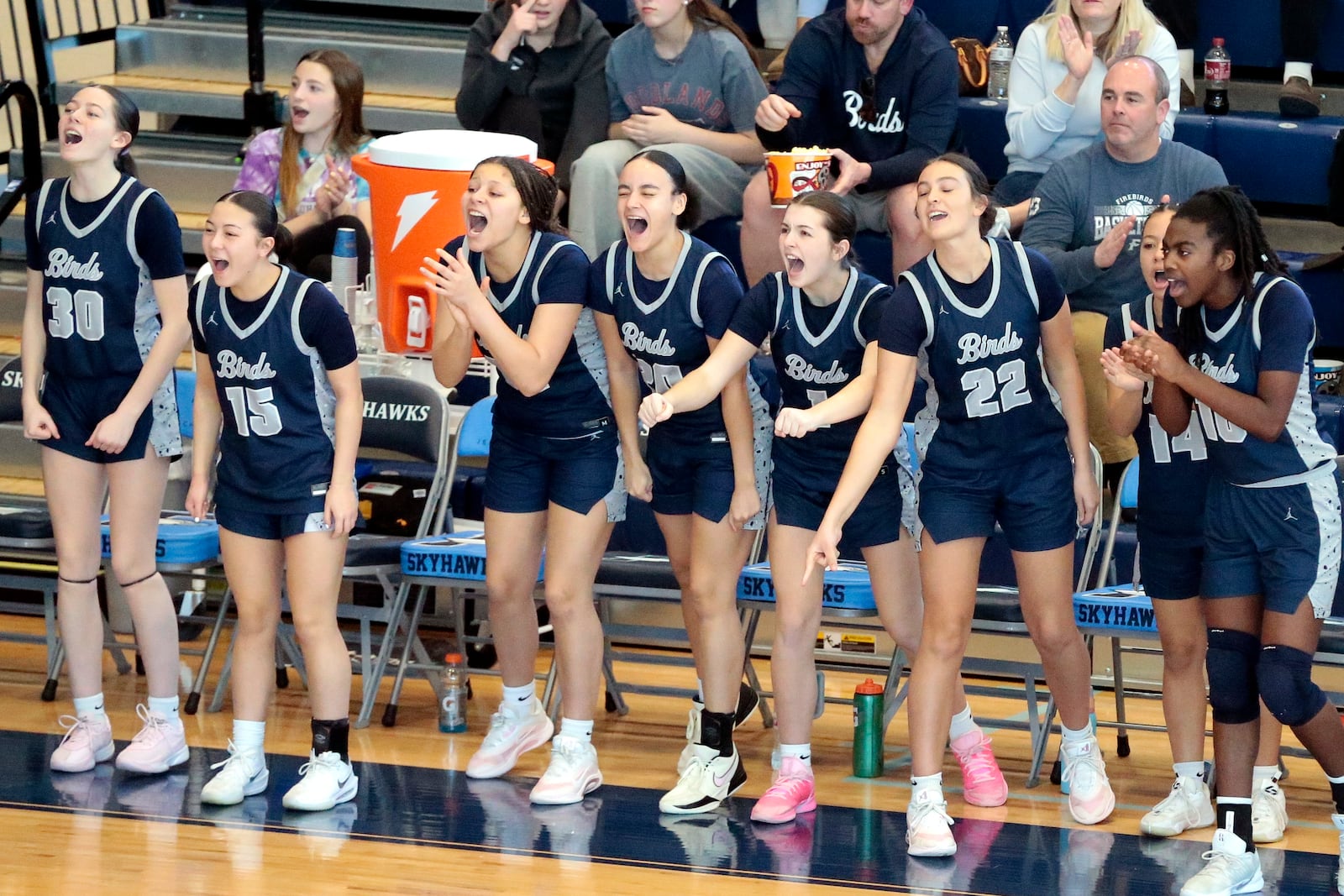 Fairmont's bench erupts after a made basket during the team's big run in the third quarter. Fairmont defeated Mason 61-31 in a Division I district championship game on Saturday, Feb. 28, 2026, in Fairborn. STEVEN WRIGHT / STAFF