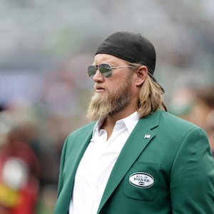 FILE - Former New York Jets player Nick Mangold walks the field before an NFL football game against the Cincinnati Bengals, Sept. 25, 2022, in East Rutherford, N.J. (AP Photo/Adam Hunger, File)