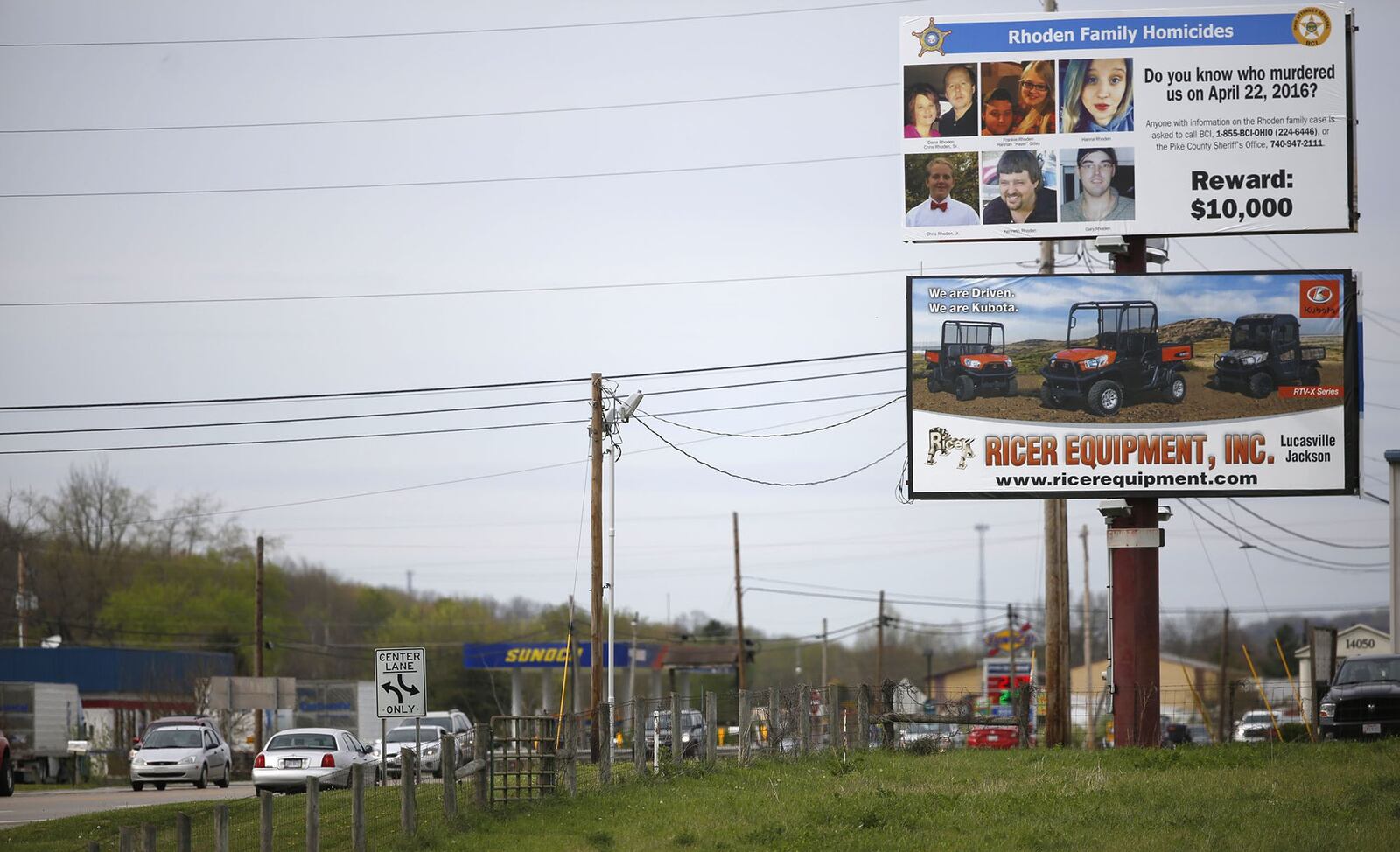 A billboard seeking information about the Rhoden family murders is seen along Ohio 23 near Waverly. Eight members of the Rhoden family were killed in rural Pike County in the early morning hours of April 22, 2016. One year later, the murder case remains unsolved. TY GREENLEES / STAFF