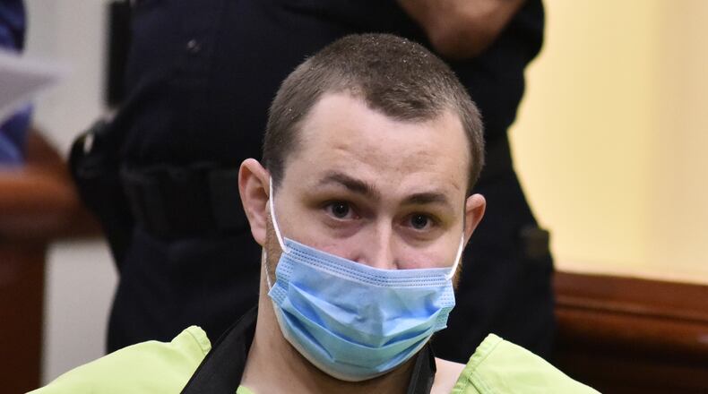 Alex Hoskins, 26, of Ross Twp. Alex Hoskins, 26, of 4219 Jennifer Drive, appeared in Hamilton Municipal Court on child pornography and felonious assault charges stemming from his May 10, 2021, arrest at his home. He is charged on three counts illegal use of a minor in nudity-oriented material or performance and felonious assault. He was also shot by a Butler County Sheriff's deputy, and was treated and released from Kettering Health Hamilton Hospital. NICK GRAHAM/STAFF