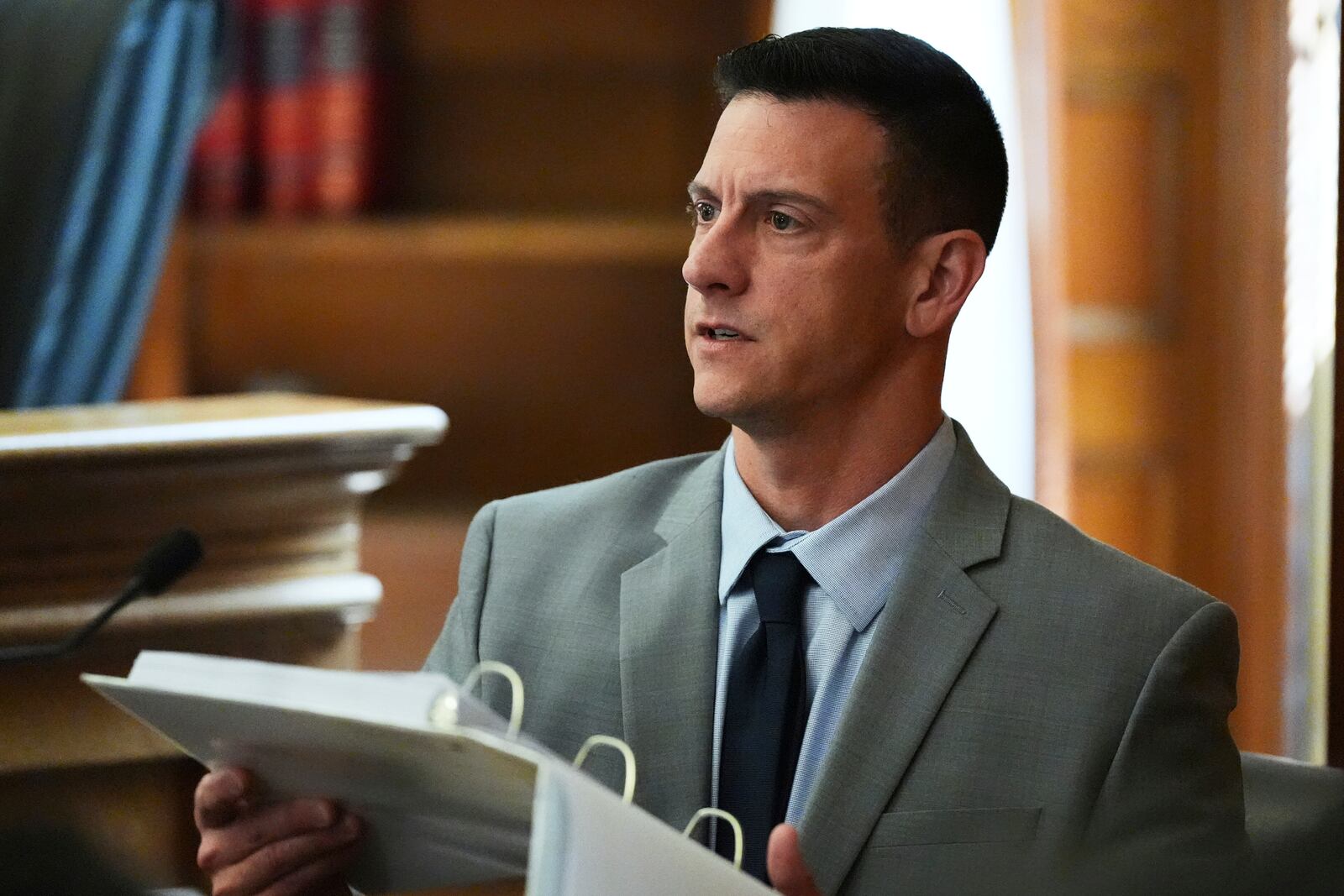 Mass. State Police detective Nicholas Guarino reviews cellular phone logs while testifying during the Karen Read trial at Norfolk Superior Court, Thursday, April 24, 2025, in Dedham, Mass. (AP Photo/Charles Krupa, Pool)