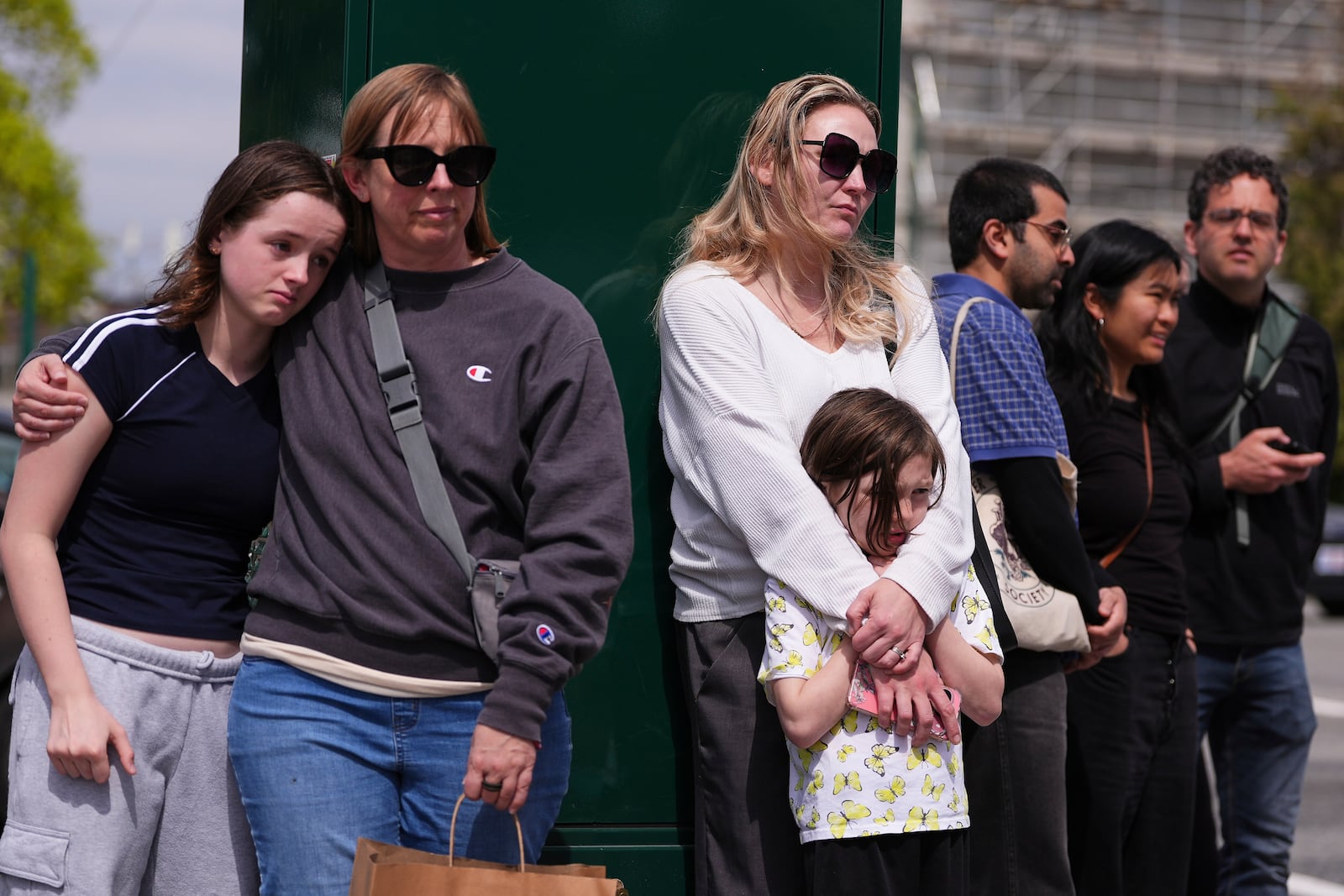 People view a growing memorial near the scene where a driver killed multiple people the previous day during a Filipino community festival Sunday, April 27, 2025, in Vancouver, British Columbia. (AP Photo/Lindsey Wasson)