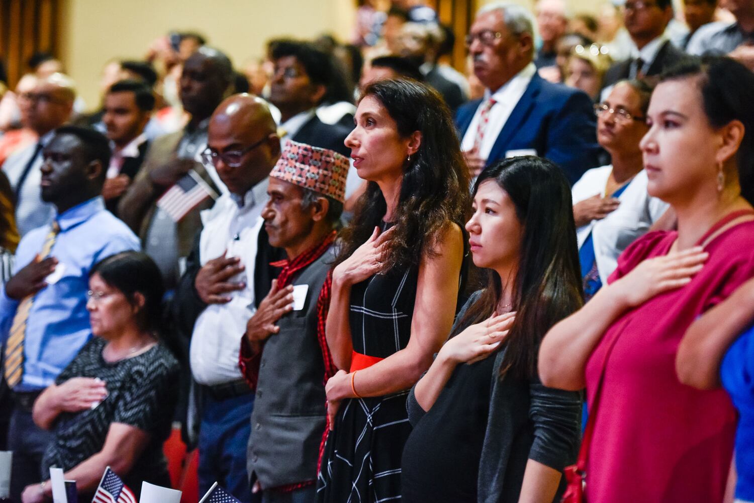 Nearly 100 people become U.S. citizens at naturalization ceremony at Miami Hamilton