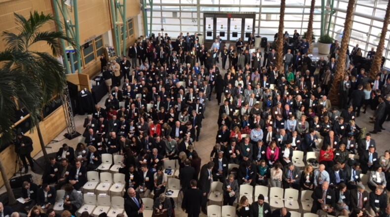 Attendees assembled at the Schuster Center in downtown Dayton before the start of last week’s Dayton Development Coalition’s annual meeting. THOMAS GNAU/STAFF